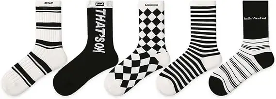 Five black-and-white novelty mid-calf socks in mixed patterns
